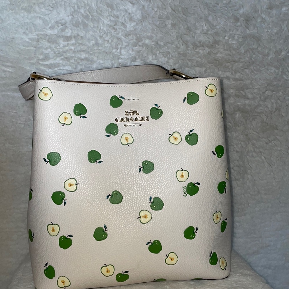 Coach white town bucket bag. White leather green apple print. Strap included.